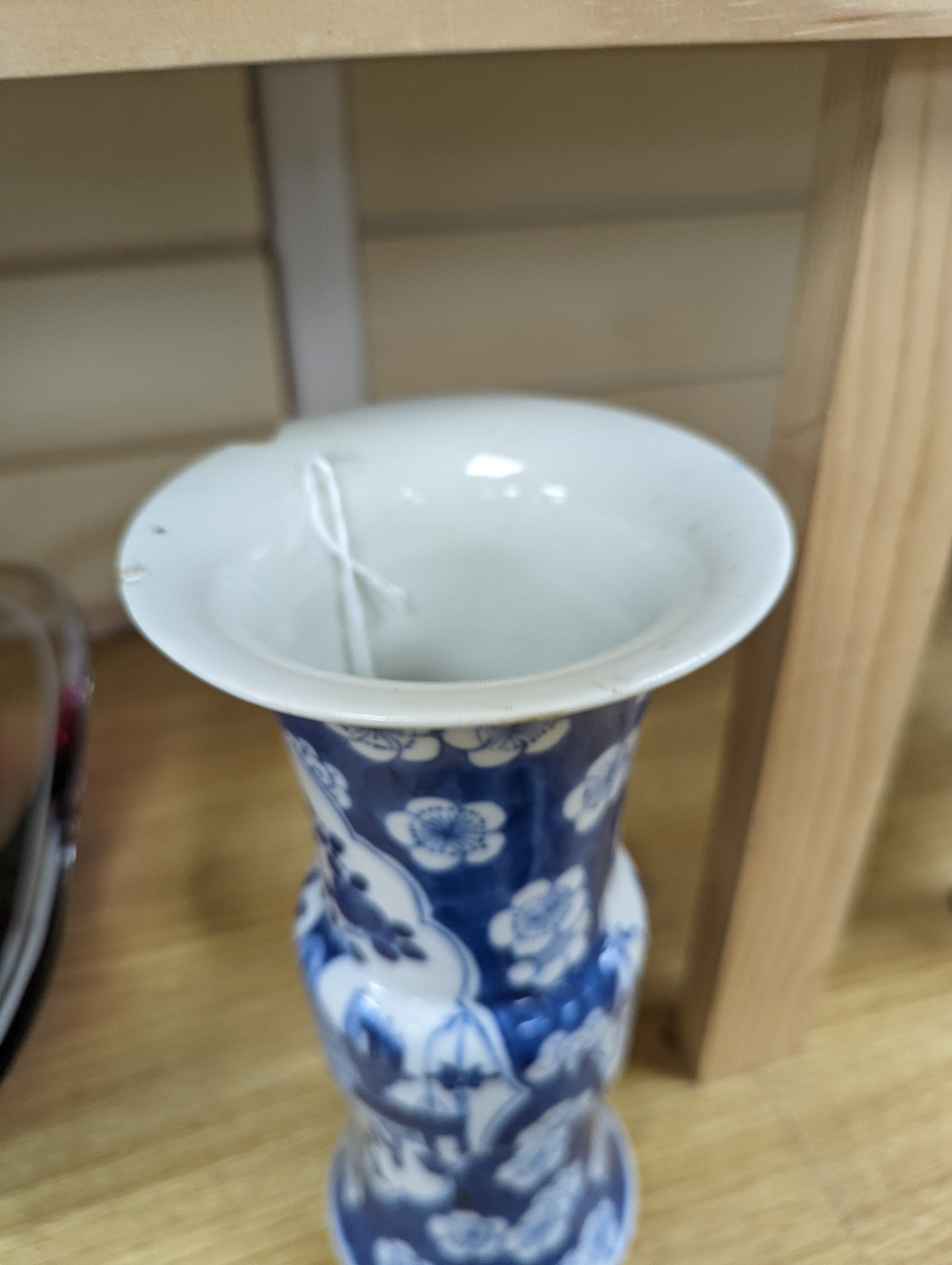 A 19th century Chinese blue and white prunus gu vase, 25 cms high.